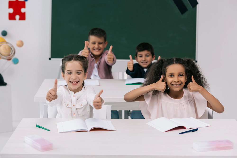 kids in classroom thumbs up for february advocacy dates