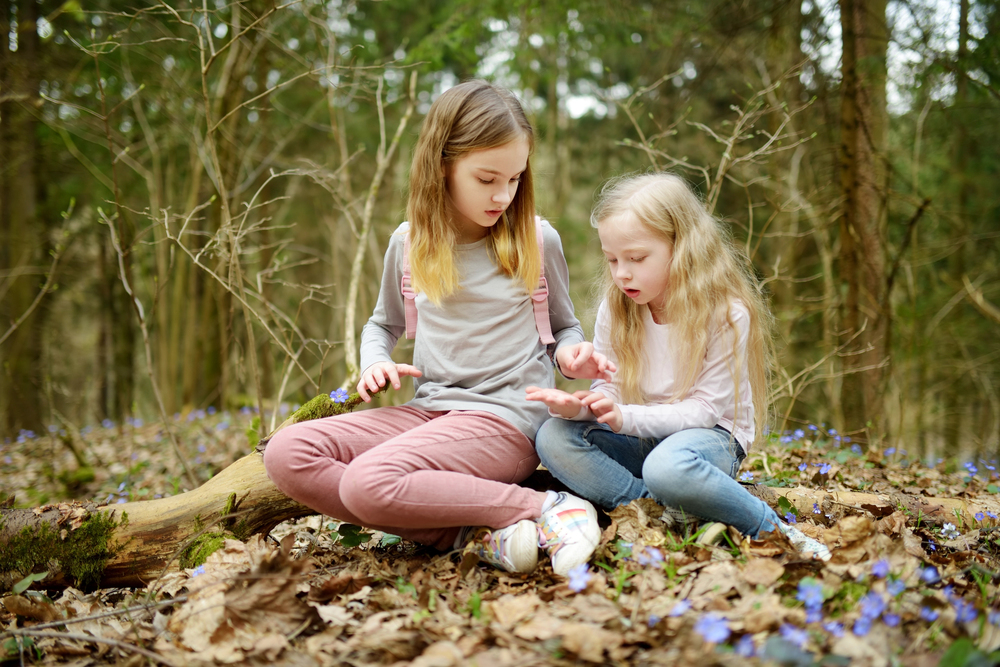 advocacy dates for march little girls looking at notes