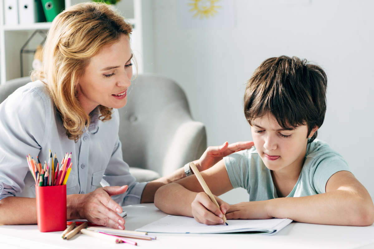 teacher working with student with dyslexia