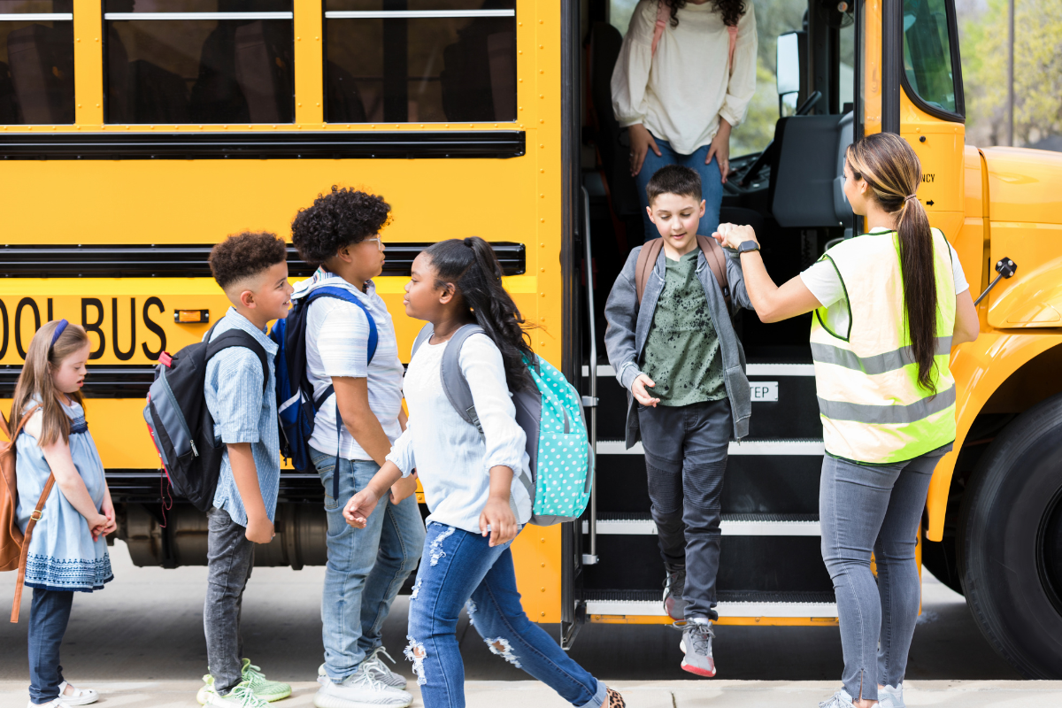 students getting off the bus
