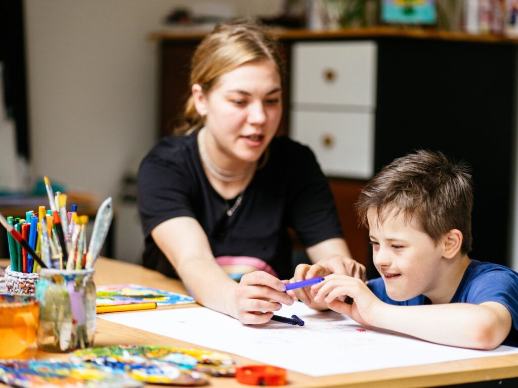 special education teacher and student