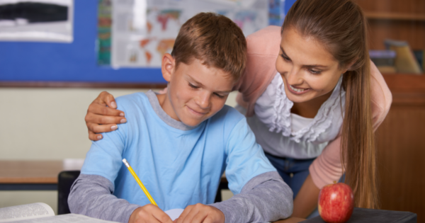 teacher helping student