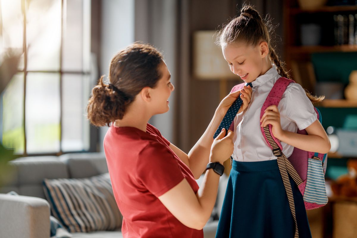 mom fixing backpack